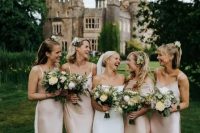 pale pink slip maxi bridesmaid dresses with mermaid tails and V-necklines are amazing for a dreamy castle wedding