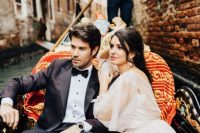 riding a gondola is a lovely idea for a refined Venice wedding, this is a symbol of the city