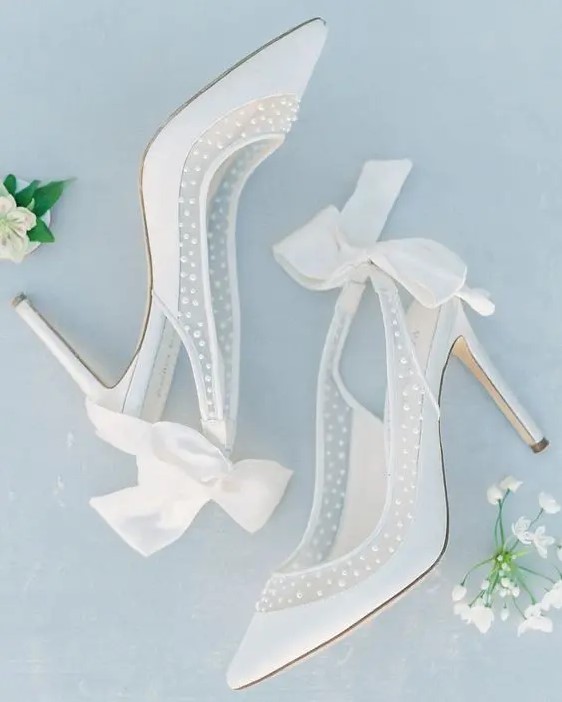 super delicate and girlish white and semi sheer wedding shoes with pearls and white silk bows on the backs are adorable and chic