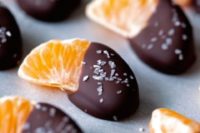 tangerine pieces with chocolate and coconut flakes on top are a cool idea for a New Year’s wedding