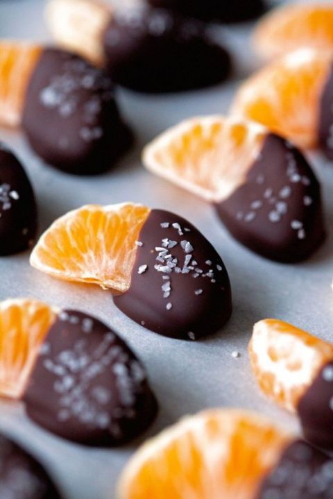 tangerine pieces with chocolate and coconut flakes on top are a cool idea for a New Year's wedding