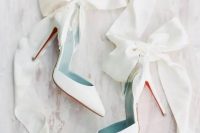 white wedding heels accented with oversized white silk ribbon bows are an amazing solution for a girlish and glam bridal look