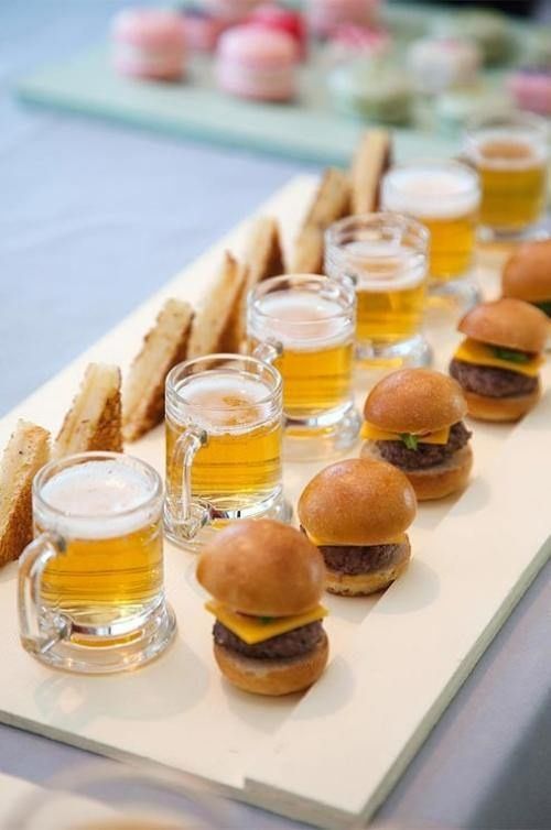 a cool fast food tray with beer mugs, hot sandwiches and mini burgers is great for a modern wedding