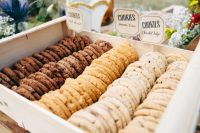 a crate with various types of cookies, which you can DIY, is a lovely wedding dessert bar idea