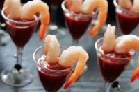 a delicious seafood snack – large shrimps and hot tomato sauce to enjoy