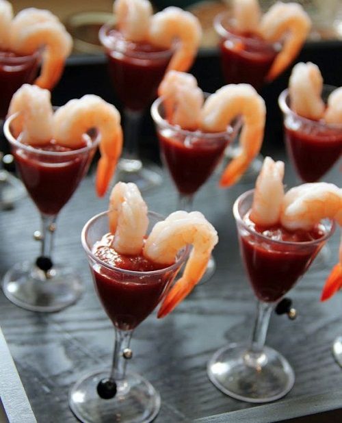 a delicious seafood snack - large shrimps and hot tomato sauce to enjoy