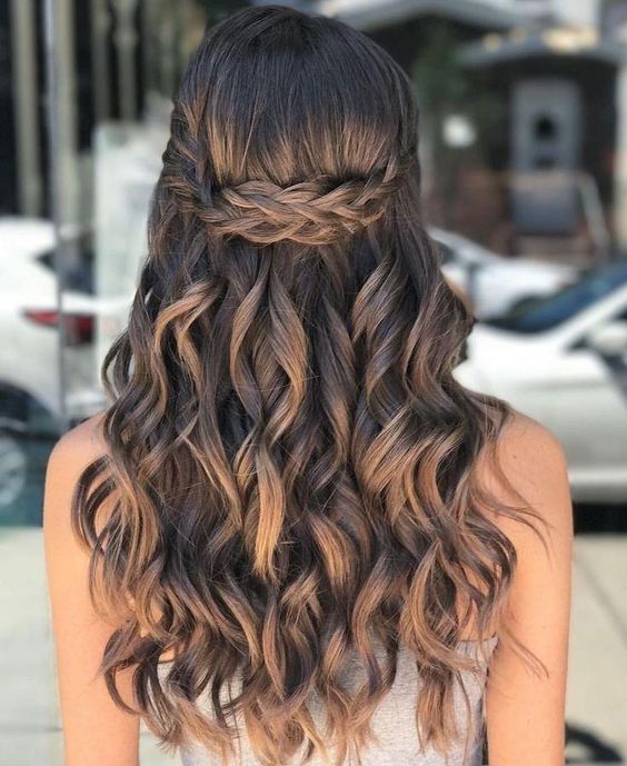 a gorgeous wavy half updo with a Celtic braid element on top is a stunning idea to show off your locks