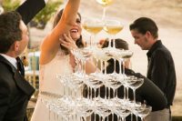 a large champagne tower is a great idea for any 1920s inspired wedding or a wedding-related party