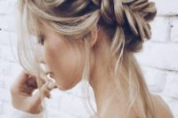 a loose fishtail updo with locks down is a chic and sexy idea for a boho or rustic bride