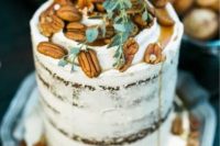 a naked weddingcake topped with caramel and pecans plus greenery is a cool decadent idea for a wedding