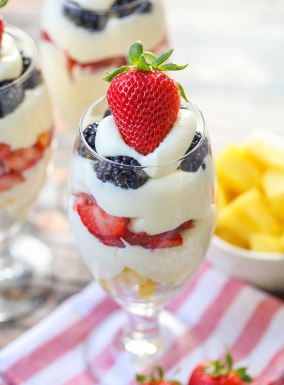 a parfait with blackberries, strawberries, pineapples is a cool idea for a summer or tropical wedding