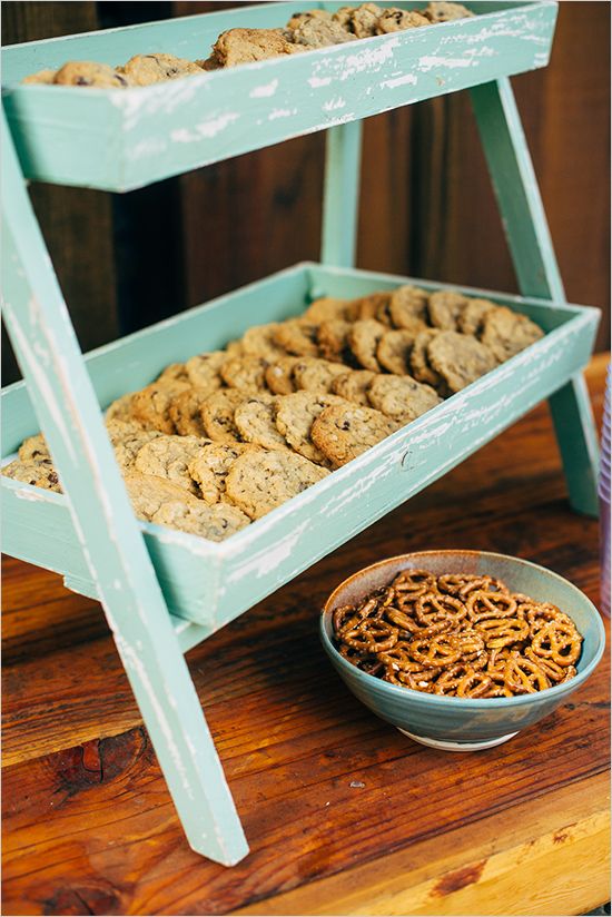 a shabby chic turquoise cookie display for a rustic and vintage-inspired wedding
