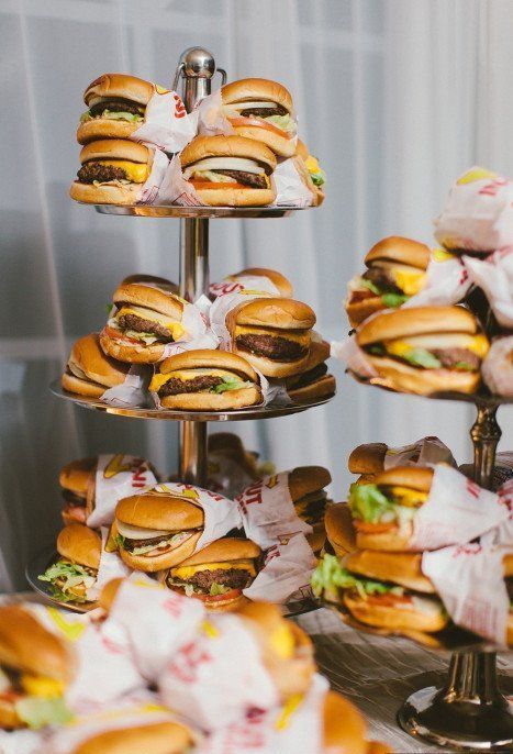 a wedding buger bar is a timeless and casual idea for a modern wedding, wrap them in paper for more comfort