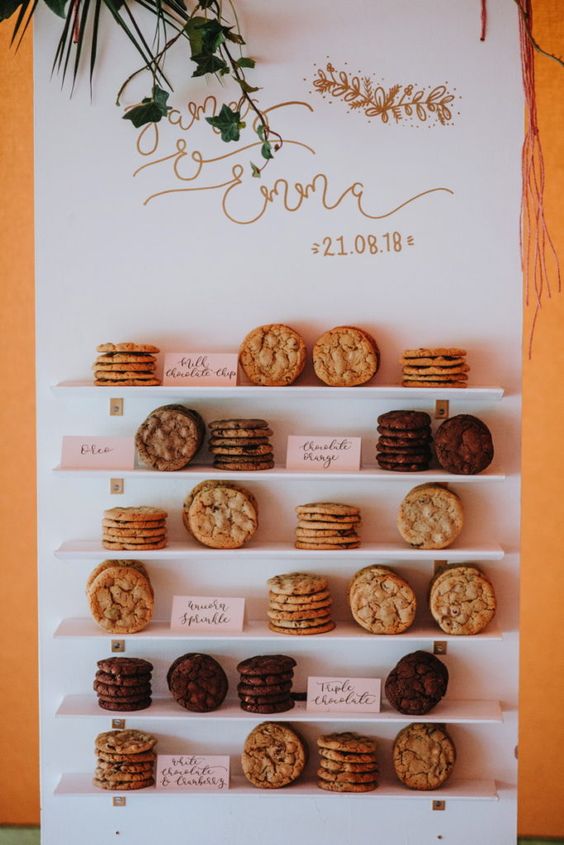 a wedding cookie wall is an ultra-modern and trendy take on a usual cookie bar, and is an edgy decor idea