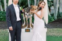 a whimsy idea – a dog kissing booth – offer your dogs’ kisses to let them participate in the wedding