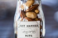 an elegant jar with a lid and a label filled with nuts is a chic and stylish way to serve and give nuts