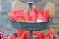 serve fresh watermelon slices on a tin stand to make everyone happy and refreshed, this is a true summer treat