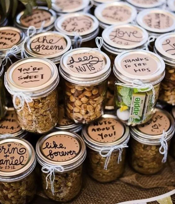 various nuts packed into jars, with some personalized messages on lids are amazing wedding favors, make some yourself