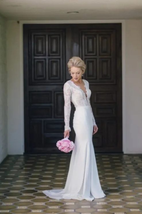 a beautiful lace mermaid wedding dress with a plunging neckline and a small train is a stylish idea for a sexy statement at the wedding
