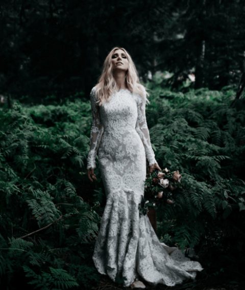 a modest yet sexy lace mermaid wedding dress with long sleeves and a high neckline is a gorgeous way to show off your curves