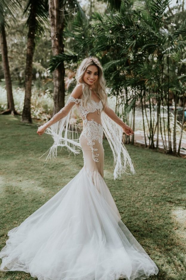  a fantastic off the shoulder lace mermaid wedding dress with fringe, a train and beading plus a sexy cutout right on the ABS