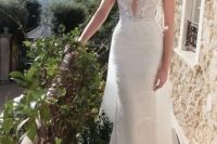 09 a super sexy and bold sheath spaghetti strap wedding dress with a plunging neckline and a train just wows, and statement earrings add to the look