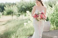 11 a romantic lace mermaid wedding dress with an illusion strapless neckline and a train for a chic and very feminine look