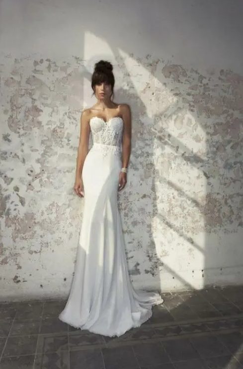 a gorgeous sexy strapless mermaid wedding dress with a lace bodice and a plain skirt plus a train will help you to look very attractive at the wedding