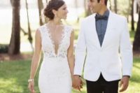36 a sleeveless fitting lace wedding dress with a covered plunging neckline – such a neckline is very sexy but the sheer cover prevents you from a wardrobe malfunction