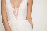 40 a beautiful A-line lace wedding dress with no sleeves and a plunging neckline with a lace cover – that’s sexy but you still feel comfortable wearing this dress