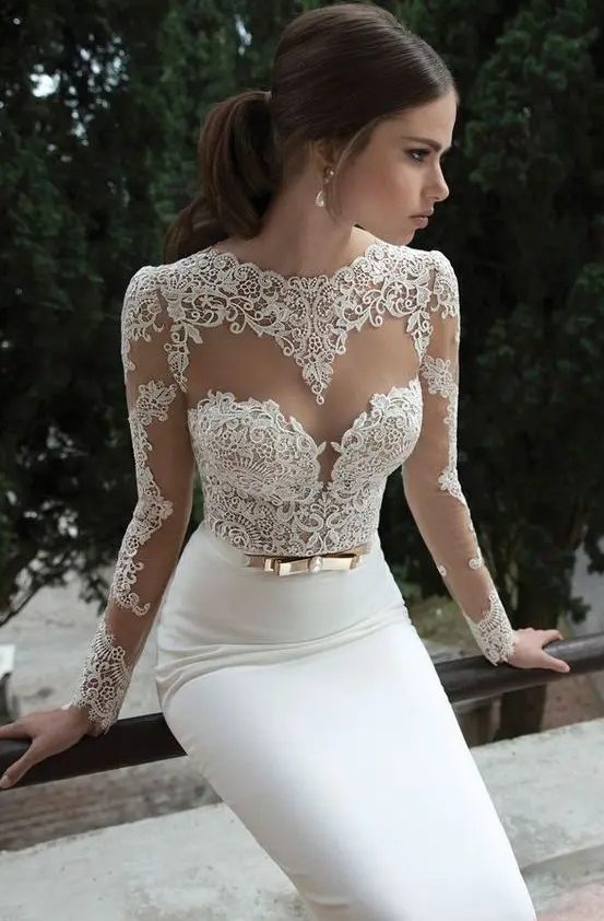 a sheath wedding dress with a lace bodice, an illusion sweetheart neckline, long sleeves and a plain skirt