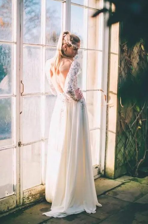 an A-line wedding dress with a lace bodice and a plain skirt plus an open back that inspires and wows - that's super sexy