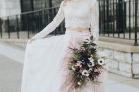 70 a gorgeous bridal look with a white lace crop top, a pink watercolor pleated skirt with a train, with a fern bridal crown and a matching bouquet