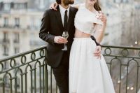 72 a modern two piece elopement ensemble with a crop top with appliques and a high low A-line skirt with a train