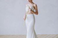 77 a feminine bridal outfit with a bandeau top and a mermaid skirt with a train is a lovely and delicate idea to try