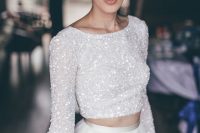 78 a glam bridal look with a white sequin crop top with long sleeves and an A-line skirt is a bold and stylish idea to show off your style