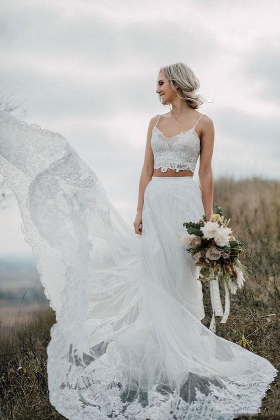 a beautiful and romantic bridal look with a spaghetti strap lace crop top and an A-line lace skirt with a train is an amazing idea