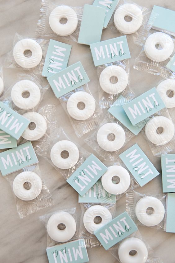 DIY mint to be rehearsal dinner favors - wrapped mints in various colors won't break the bank