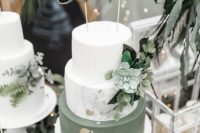 a chic white and green marble wedding cake with gold leaf, greenery and succulents plus a gold topper for a modern wedding