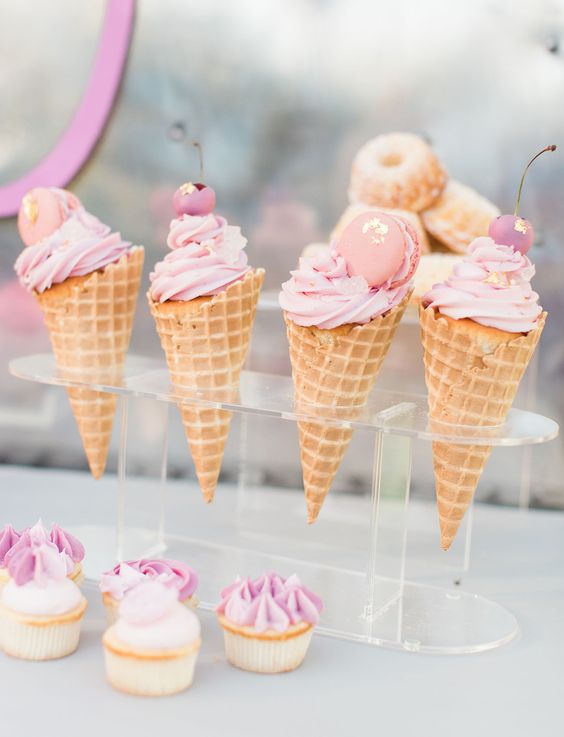 a clear acrylic stand with waffle cones and ice cream, candied berries and macarons is a lovely idea for a romantic wedding