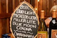 a drop-shaped wood slice chalkboard sign is a lovely idea for your bar and not only, it can be rocked throughout the venue and you can DIY as many as you need