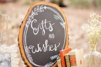 a lovely wood slice chalkboard sign with chalking is a lovely idea for a rustic wedding, you can DIY one easily