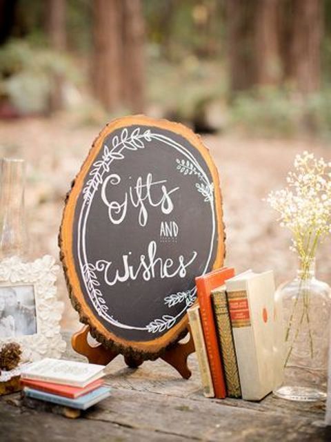 a lovely wood slice chalkboard sign with chalking is a lovely idea for a rustic wedding, you can DIY one easily