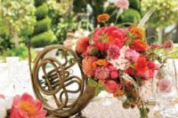a musical instrument filled with colorful blooms and greenery is a beautiful and really unique wedding centerpiece