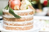 a simple yet stylish fall wedding cake with apples