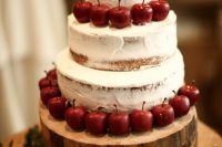 a naked wedding cake topped with red apples is a lovely idea for a rustic fall wedding, looks amazing and is easy to make