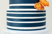 a navy and white striped wedding cake with orange blooms is a stylish idea for a nautical wedding is wow