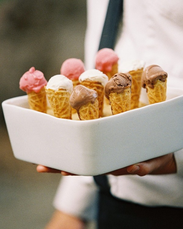 a porcelain stand with holes to hold ice cream cones is a stylish and elegant idea for a wedding