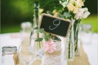 a trendy cluster wedding centerpiece with a chalkboard sign