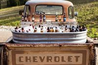 an epic wedding drink station in an old chevrolet is a lovely idea for a very rustic wedding, it’s creative and will save your budget